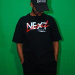 Person in black outfit, with next level front design