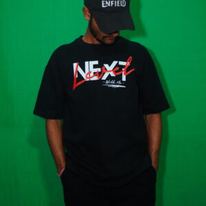 Person in black outfit, with next level front design